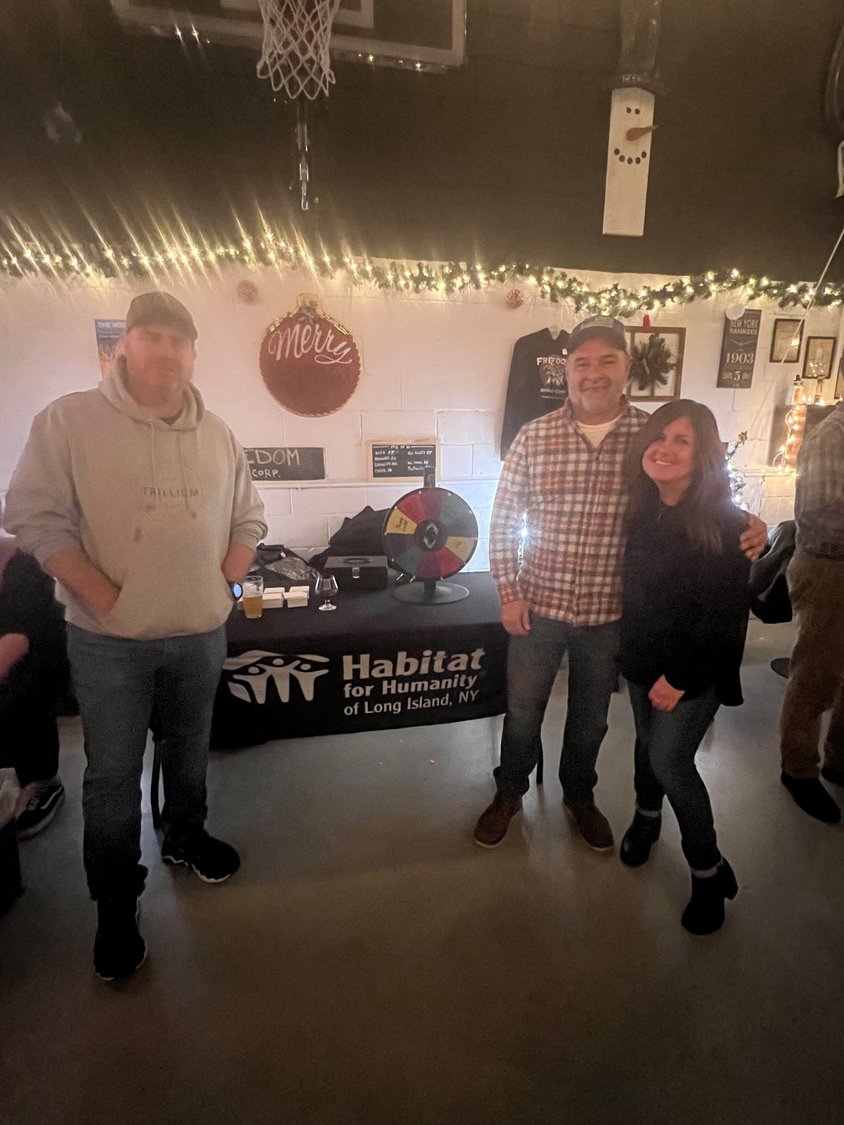 The co-owners of Freedom Brewing Corp., Mike Digregorio and Bob Gugliotta, are joined by Dawn Marie Dioguardo, senior director of development at Habitat for Humanity of Long Island, at the charitable and fun event.